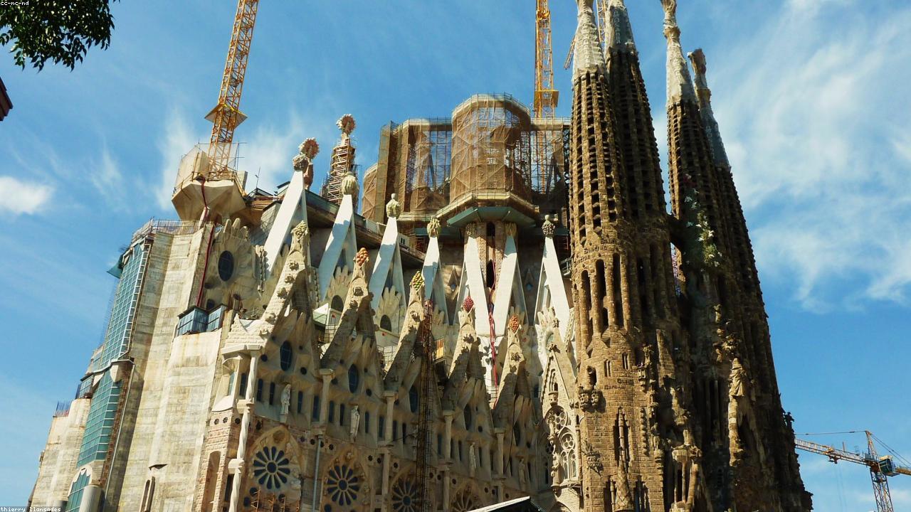 Sagrada Família spires above Barcelona rooftops.