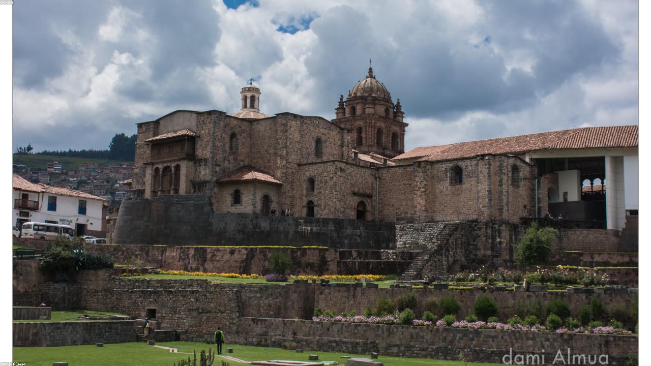 Terracotta-tiled roofs of Cusco stretch toward Andean peaks.