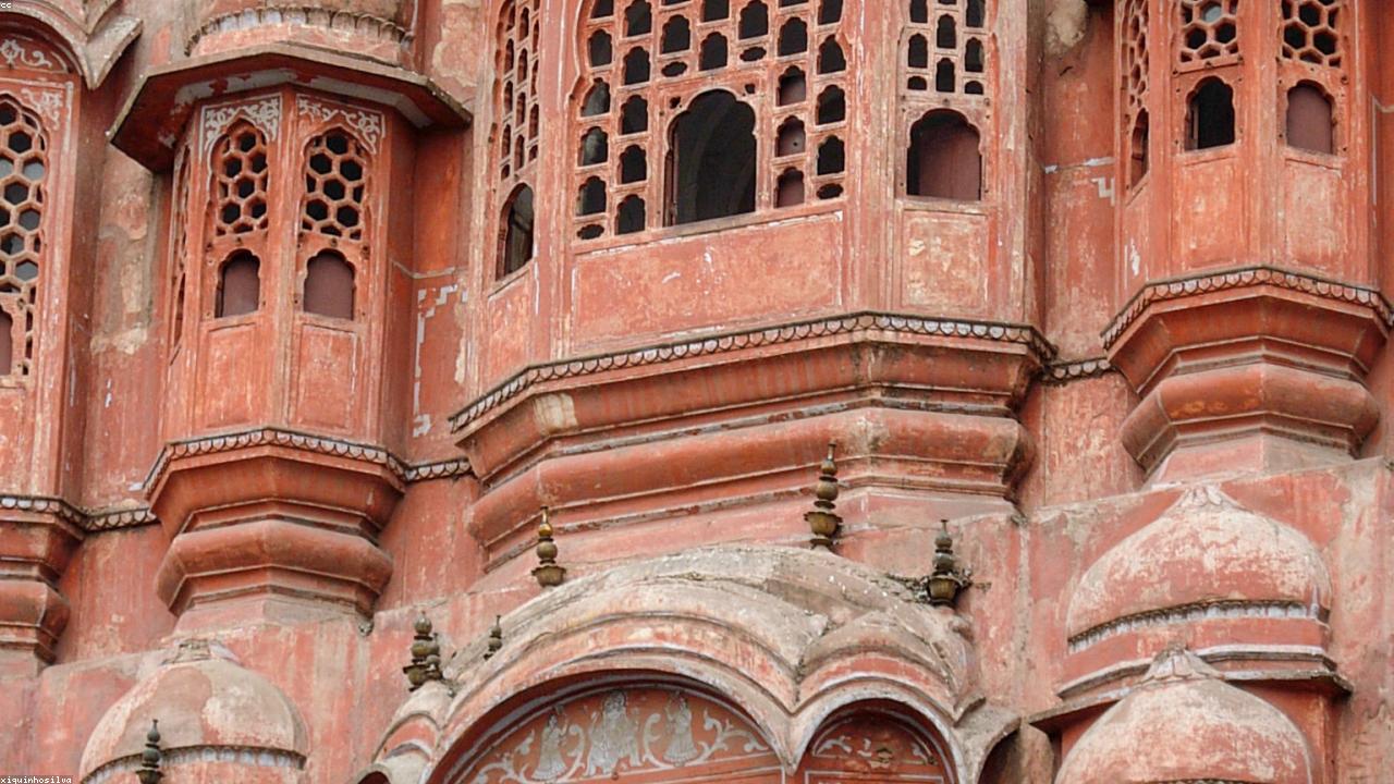 Hawa Mahal's pink-orange honeycomb facade in golden light.