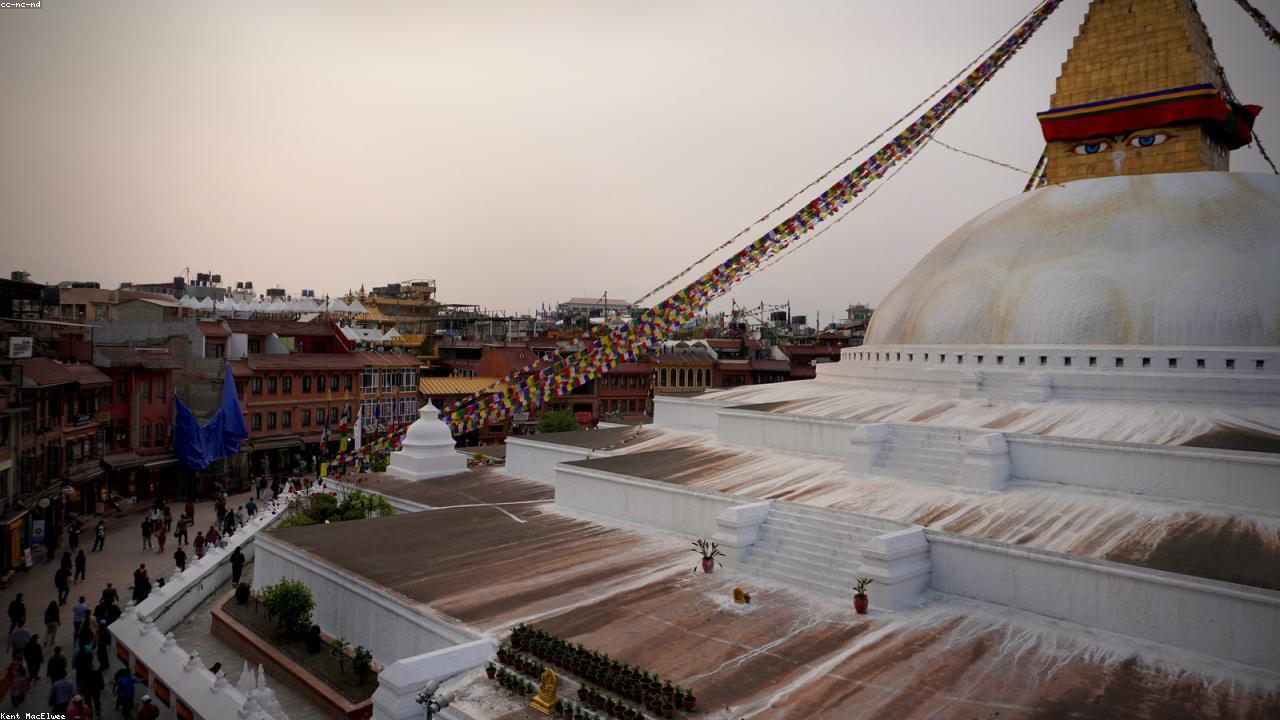 Prayer flags and Buddhist eyes on Boudhanath stupa, Kathmandu.