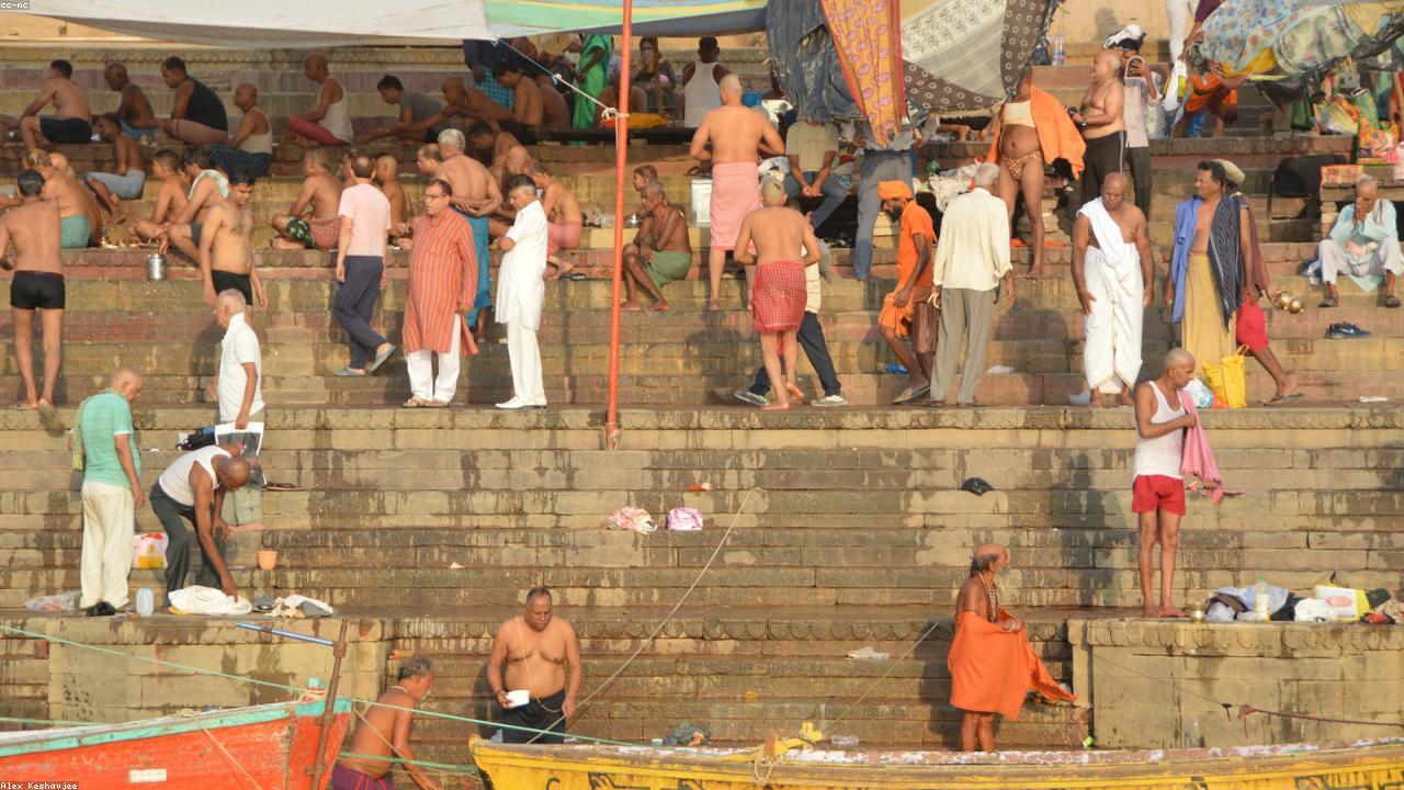 Dawn pilgrims and rowboats on the Varanasi ghats.